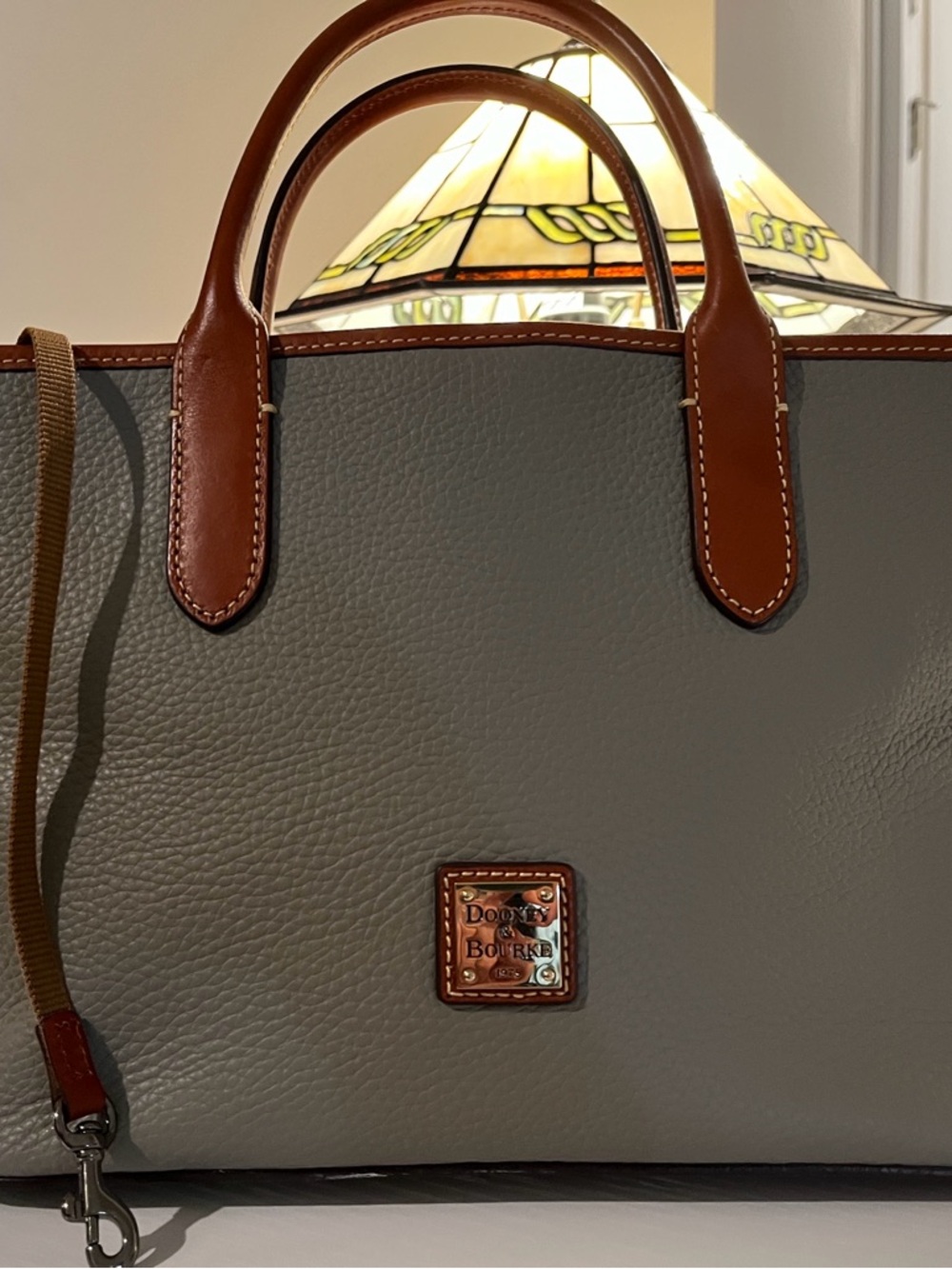 Dooney & Bourke ladies Gray purse with attractive leather trim